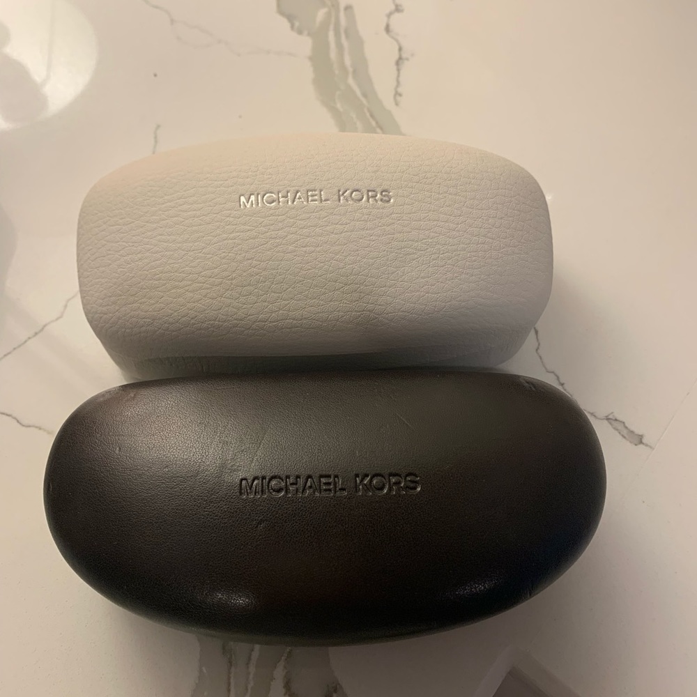 Two Michael kors cases
